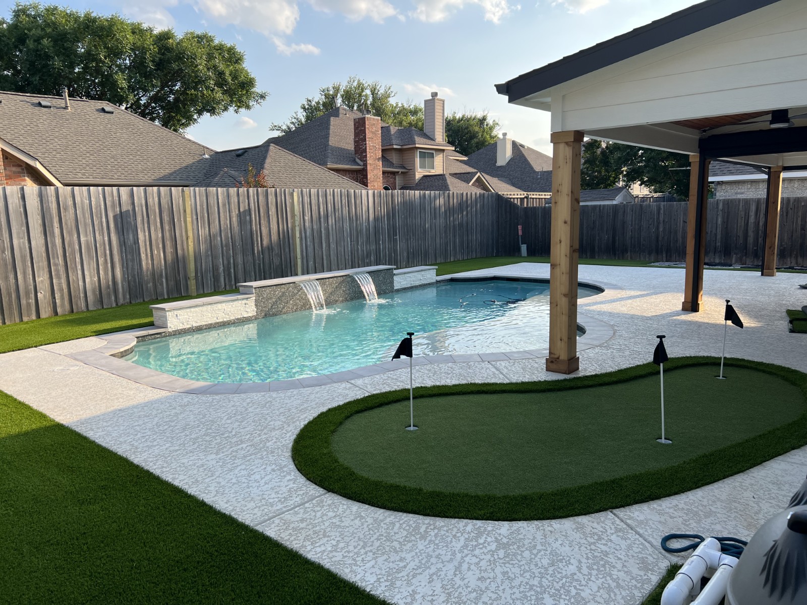 Backyard Resort: Putting Green, Artificial Turf & Landscape Rock Installation in Flower Mound, TX